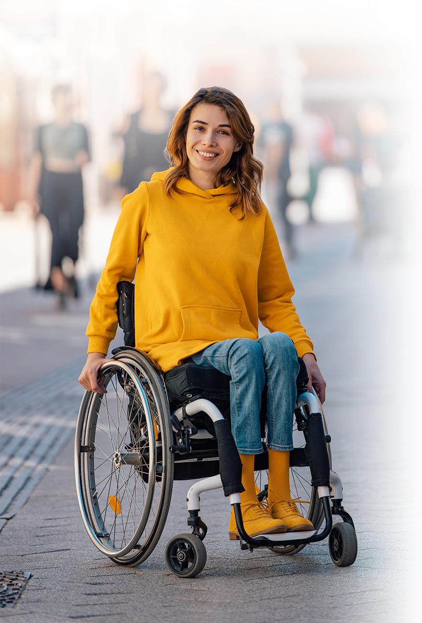 Photo of a young womn with a wheelchair.
